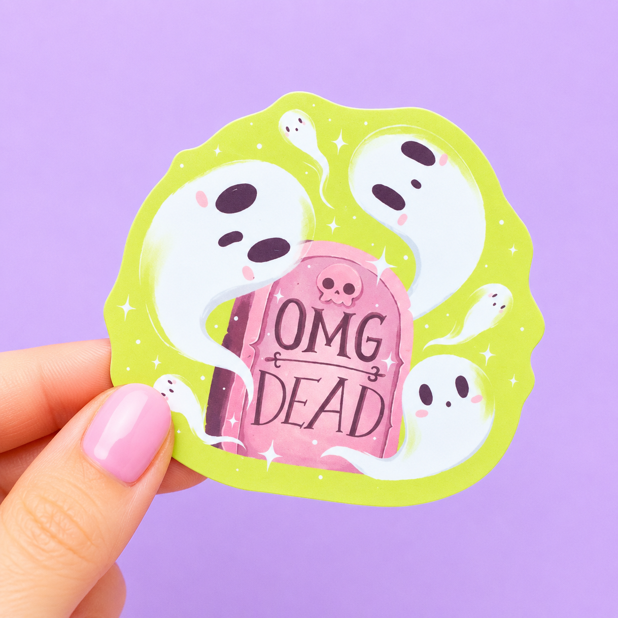 Sleazy Greetings cute die-cut vinyl sticker featuring adorable floating ghosts surrounding a pink tombstone that says ‘OMG Dead.’ Spooky cute pastel sticker with dramatic meme humor, whimsical ghost artwork, and delightfully overreactive haunted gremlin energy.