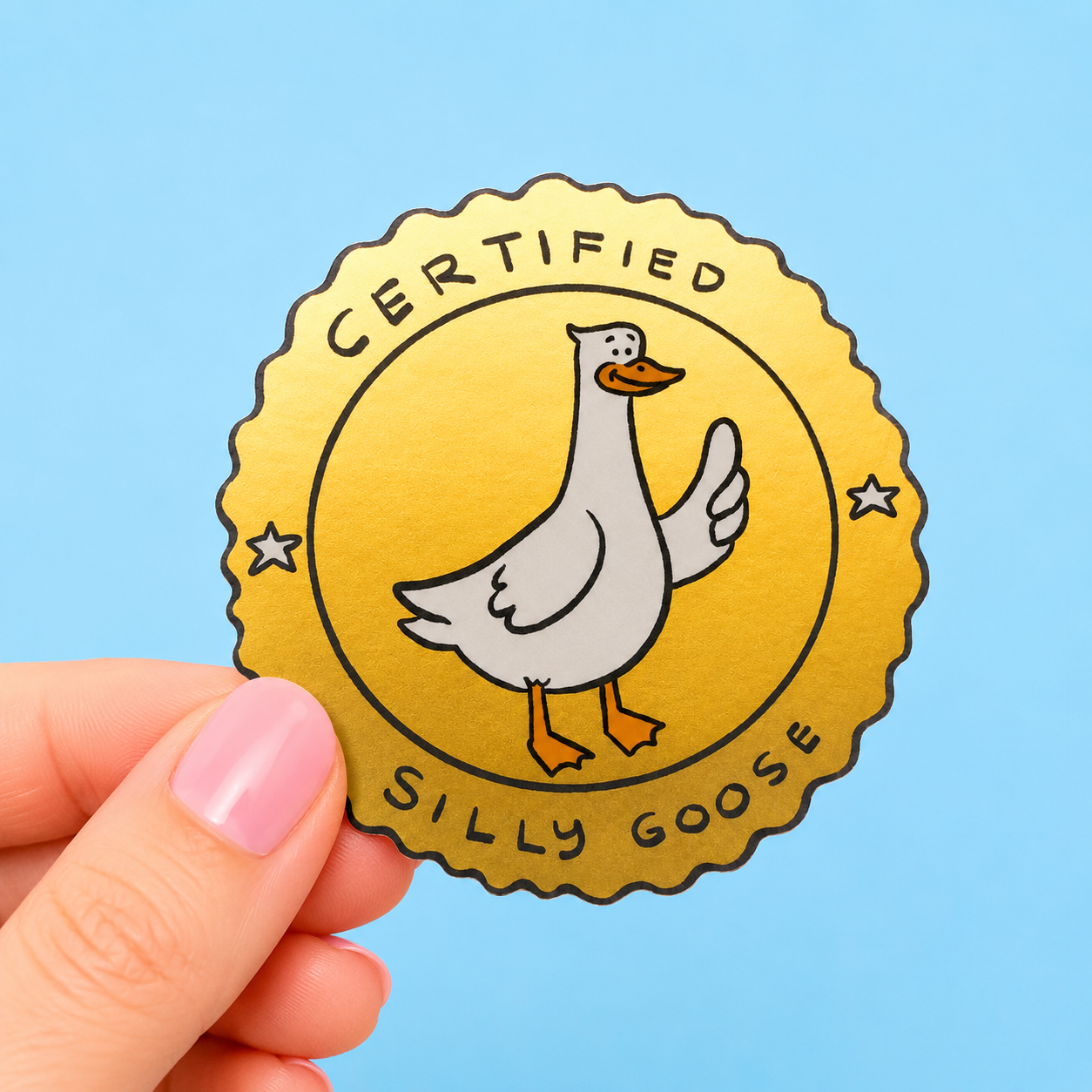Sleazy Greetings funny vinyl sticker featuring a cartoon goose giving a thumbs up inside a gold seal design with the phrase ‘Certified Silly Goose.’ Playful goose-themed sticker with whimsical artwork and fun badge-style aesthetic.
