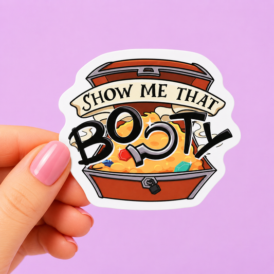 Sleazy Greetings funny die-cut vinyl sticker featuring a treasure chest overflowing with gold beside the phrase ‘Show Me That Booty.’ Cute chaotic pirate pun sticker with playful cartoon artwork, goofy treasure-hunting humor, and aggressively silly gremlin energy.