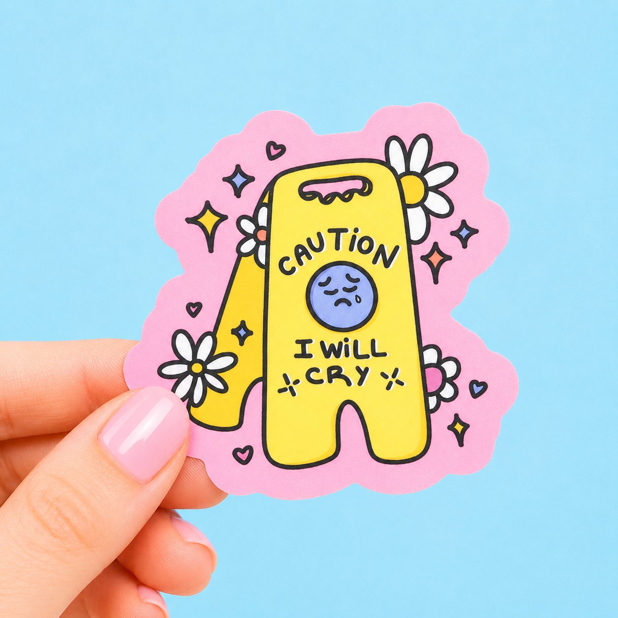 Sleazy Greetings funny die-cut vinyl sticker featuring a caution wet floor sign with the phrase ‘Caution I Will Cry’ surrounded by flowers, sparkles, and hearts. Cute emotional humor sticker with pastel colors, kawaii-inspired artwork, and anxious chaotic aesthetic.