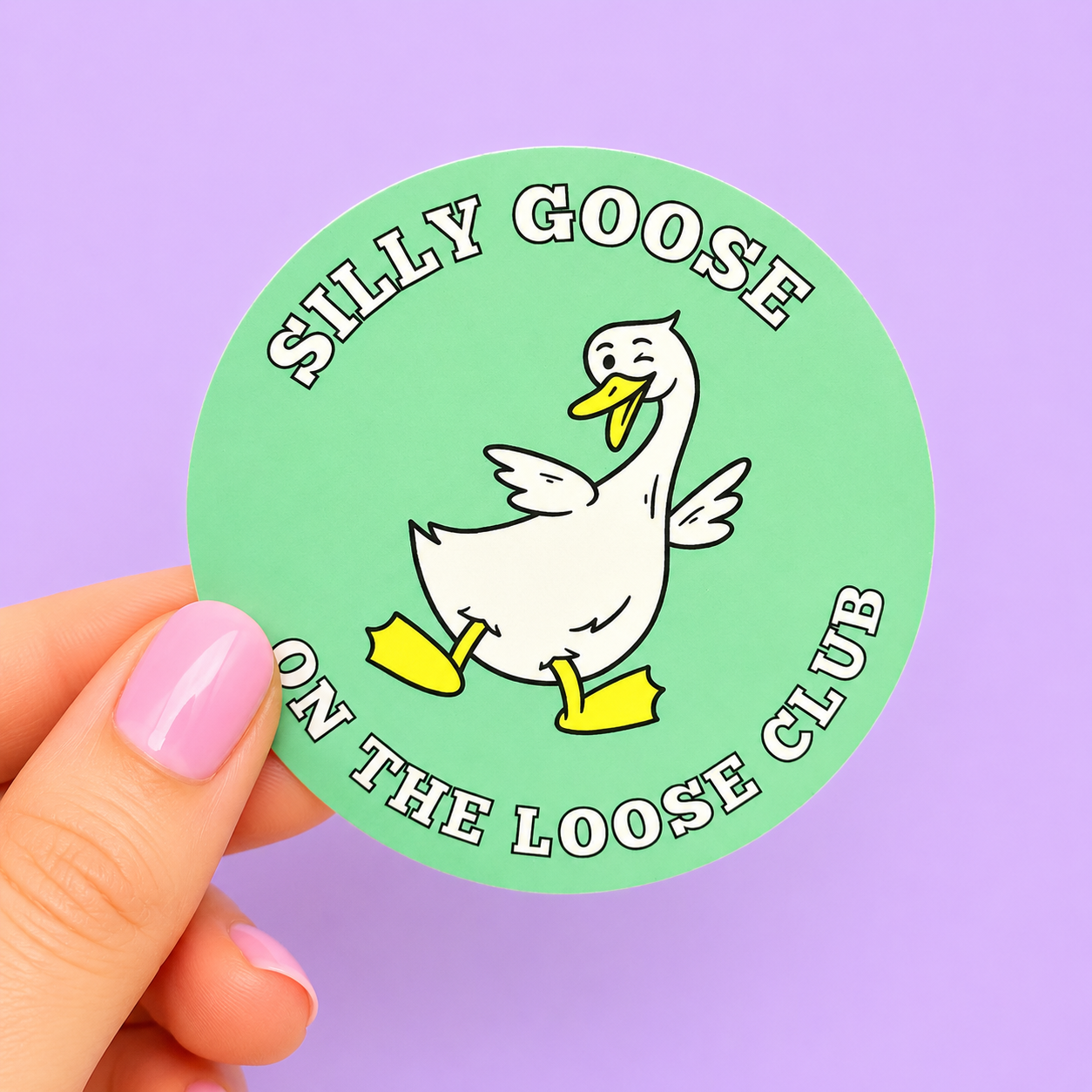 Sleazy Greetings funny round vinyl sticker featuring a cheerful cartoon goose with the phrase ‘Silly Goose On The Loose Club.’ Cute goose-themed sticker with playful mascot artwork, mint green background, and whimsical club-style aesthetic.