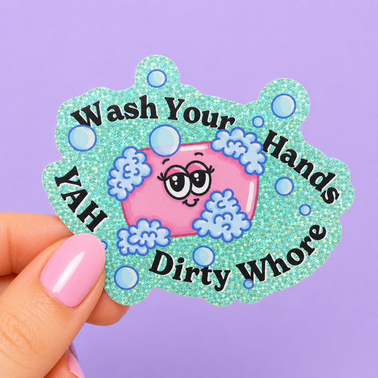 Sleazy Greetings funny holographic vinyl sticker featuring the phrase ‘Wash Your Hands Ya’ll Dirty Whore’ surrounding a cute smiling soap illustration with bubbly foam accents. Glittery sarcastic sticker with playful hygiene humor and kawaii-inspired aesthetic.