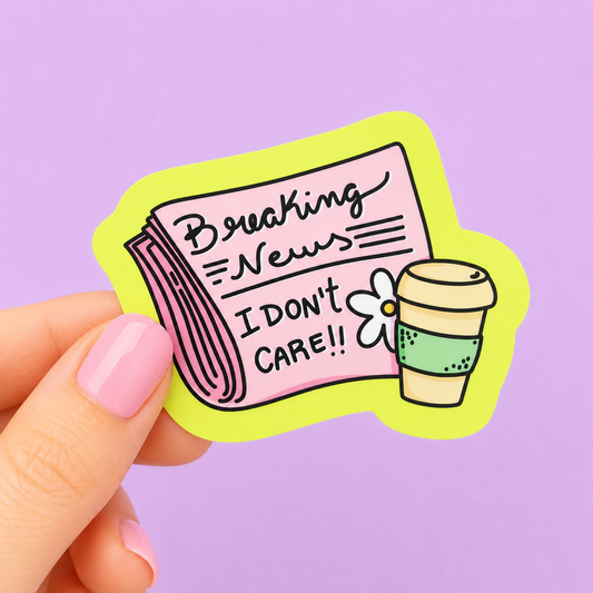 Sleazy Greetings funny die-cut vinyl sticker featuring a pink newspaper with the phrase ‘Breaking News I Don’t Care!!’ beside a coffee cup and flower illustration. Sarcastic pastel sticker with playful doodle-style artwork and trendy chaotic aesthetic.