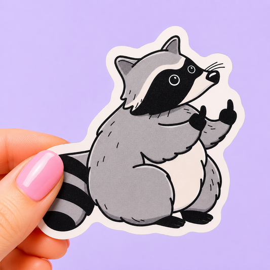 Sleazy Greetings funny die-cut vinyl sticker featuring a chunky raccoon giving double middle fingers. Cute chaotic trash-panda sticker with rebellious gremlin energy, minimalist cartoon artwork, and aggressively unbothered vibes.