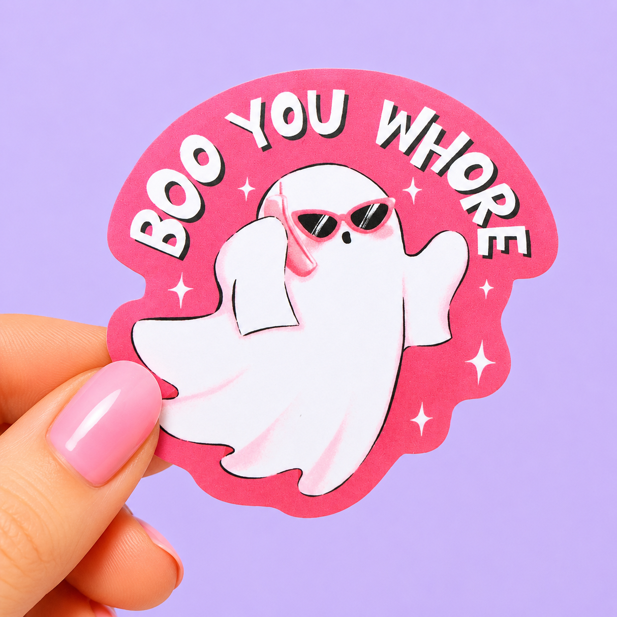 Sleazy Greetings funny die-cut vinyl sticker featuring a fashionable ghost in sunglasses beside the phrase ‘Boo You Whore.’ Chaotic spooky-girl sticker with playful pastel aesthetics, aggressively sassy energy, and glamorous little gremlin vibes.