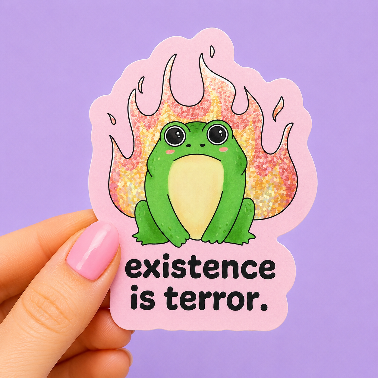 Sleazy Greetings funny die-cut vinyl sticker featuring a wide-eyed frog sitting in front of glittery flames beside the phrase ‘Existence Is Terror.’ Cute existential humor sticker with pastel colors, kawaii-inspired artwork, and chaotic emotional support aesthetic.