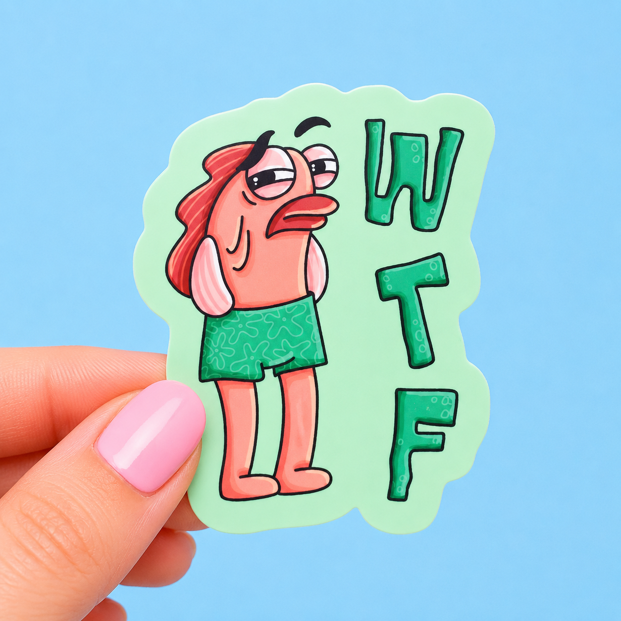 Sleazy Greetings funny die-cut vinyl sticker featuring a grumpy fish character in shorts beside the phrase ‘WTF.’ Absurd cartoon humor sticker with pastel green background, confused expression, and quirky meme-inspired aesthetic.