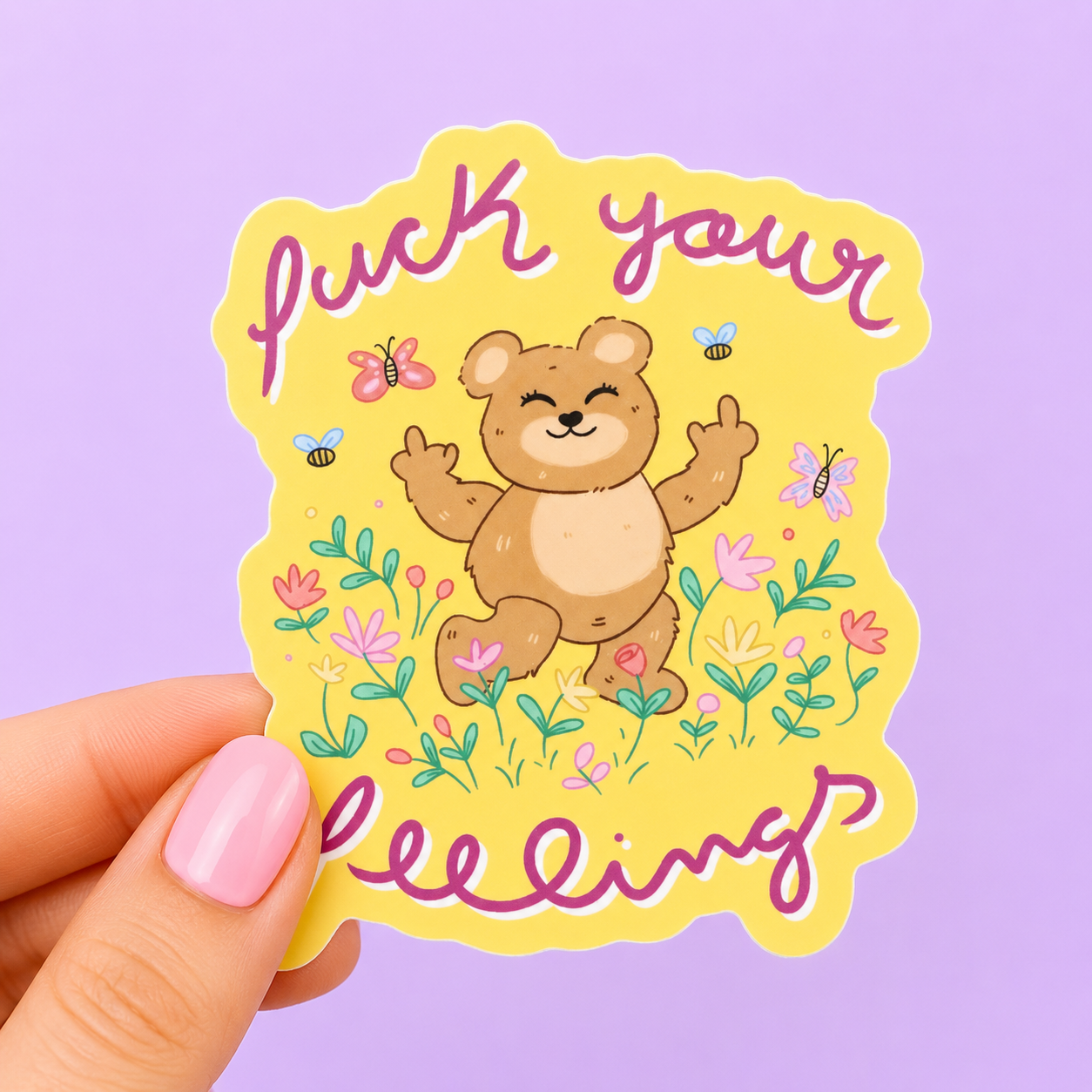 Sleazy Greetings funny die-cut vinyl sticker featuring a cheerful teddy bear flipping both middle fingers in a colorful flower field with the phrase ‘Fuck Your Feelings.’ Cute sarcastic sticker with pastel floral artwork, playful profanity, and chaotic sweet aesthetic.