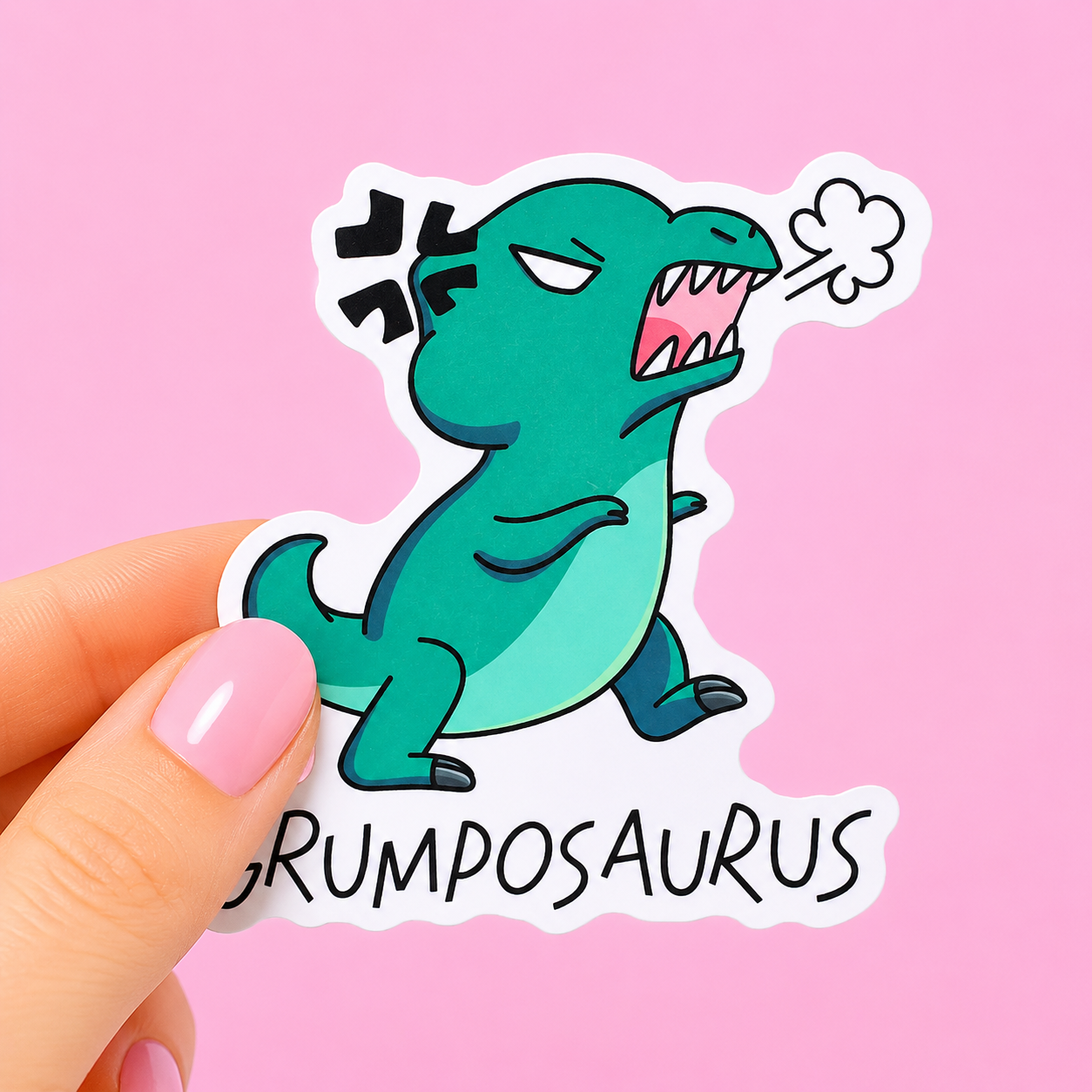 Sleazy Greetings funny die-cut vinyl sticker featuring an angry little T-Rex beside the phrase ‘Grumposaurus.’ Cute chaotic dinosaur sticker with grumpy gremlin energy, playful cartoon artwork, and relatable “don’t talk to me” vibes.
