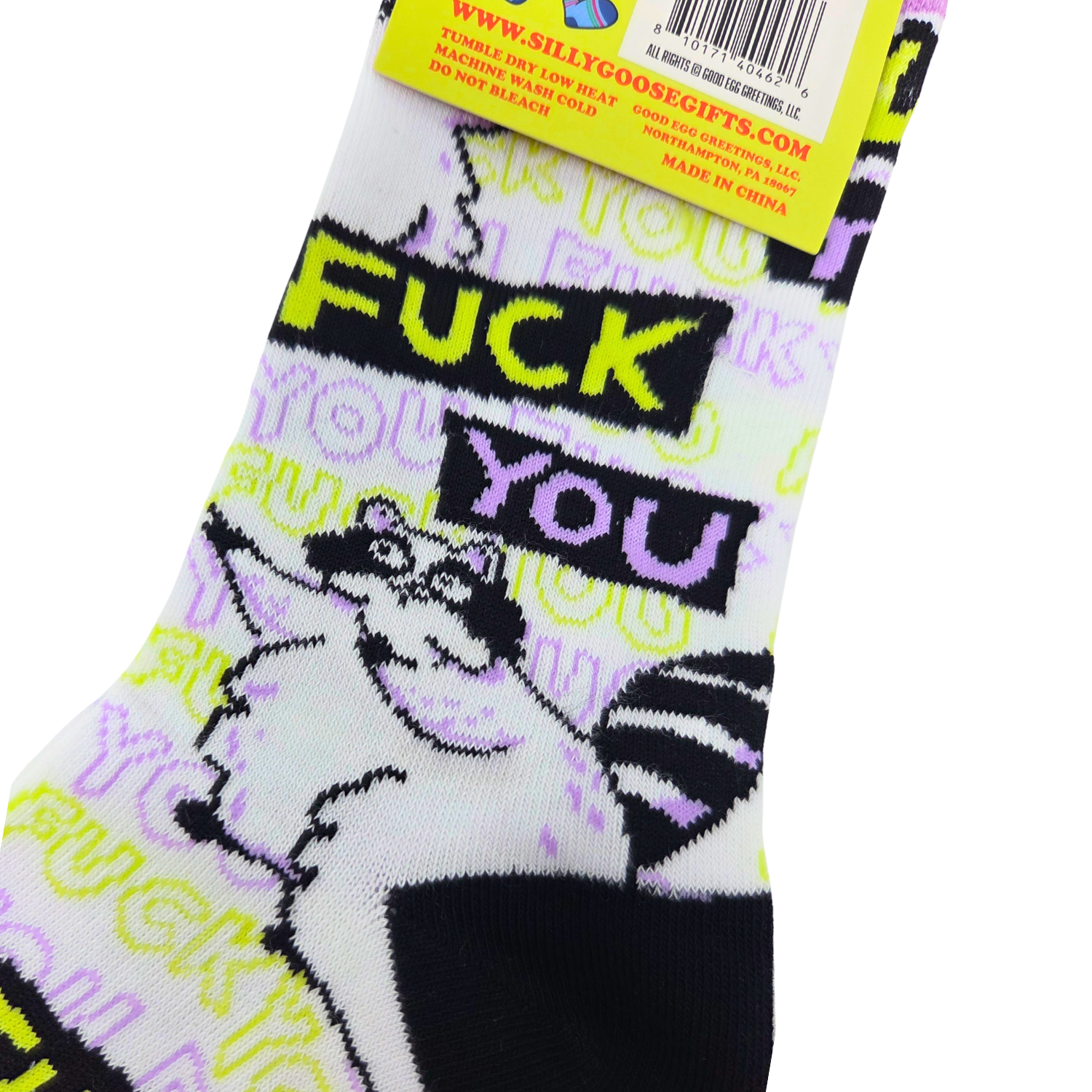 Sleazy Greetings novelty crew socks featuring grumpy cartoon raccoons and repeated ‘Fuck You’ typography in bold black, neon yellow, lavender, and white colors. Funny sarcastic statement socks with chaotic meme-inspired artwork and edgy humorous style.