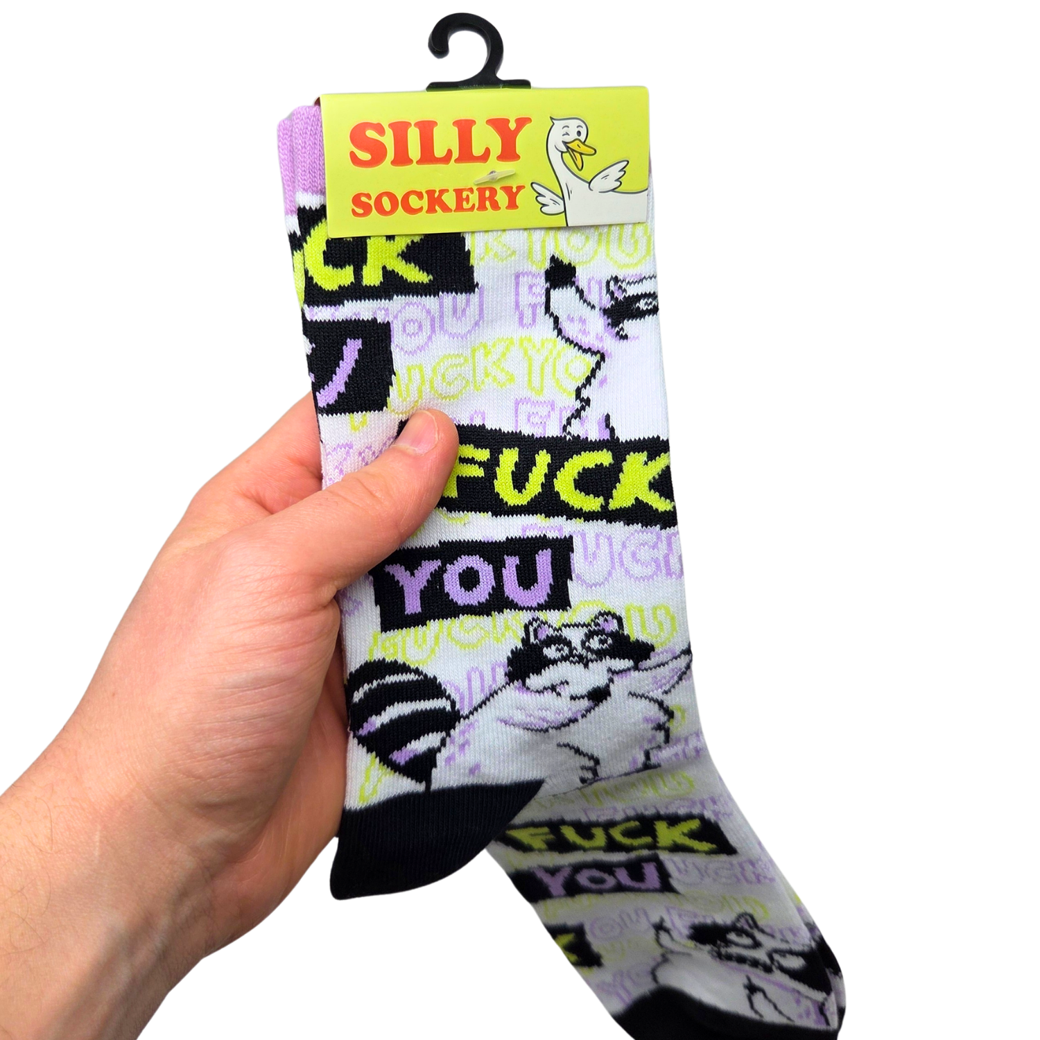 Sleazy Greetings novelty crew socks featuring grumpy cartoon raccoons and repeated ‘Fuck You’ typography in bold black, neon yellow, lavender, and white colors. Funny sarcastic statement socks with chaotic meme-inspired artwork and edgy humorous style.