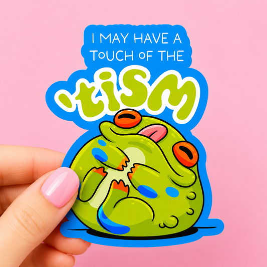 Sleazy Greetings funny die-cut vinyl sticker featuring a goofy cartoon frog licking itself beside the phrase ‘I May Have a Touch of the ’tism.’ Cute neurodivergent meme sticker with chaotic frog energy, bold colorful artwork, and playful internet humor aesthetic.