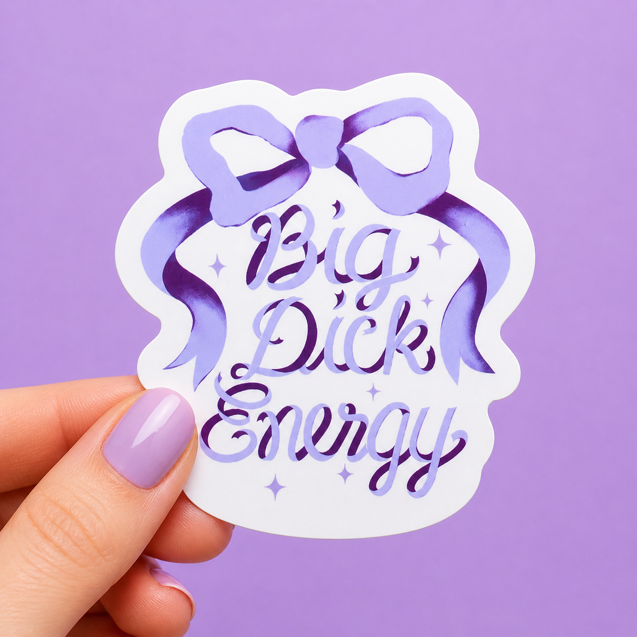 Sleazy Greetings funny die-cut vinyl sticker featuring elegant purple ribbon artwork beside the phrase ‘Big Dick Energy.’ Chaotic confidence sticker with sparkly feminine aesthetics, playful watercolor-style typography, and aggressively iconic gremlin vibes.