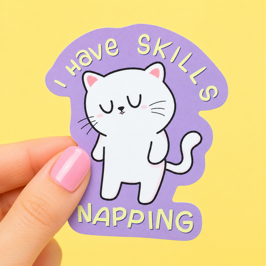 Sleazy Greetings cute die-cut vinyl sticker featuring a sleepy little cat beside the phrase ‘I Have Skills Napping.’ Cozy kawaii-style sticker with relatable lazy-day humor, minimalist pastel artwork, and professional nap goblin energy.