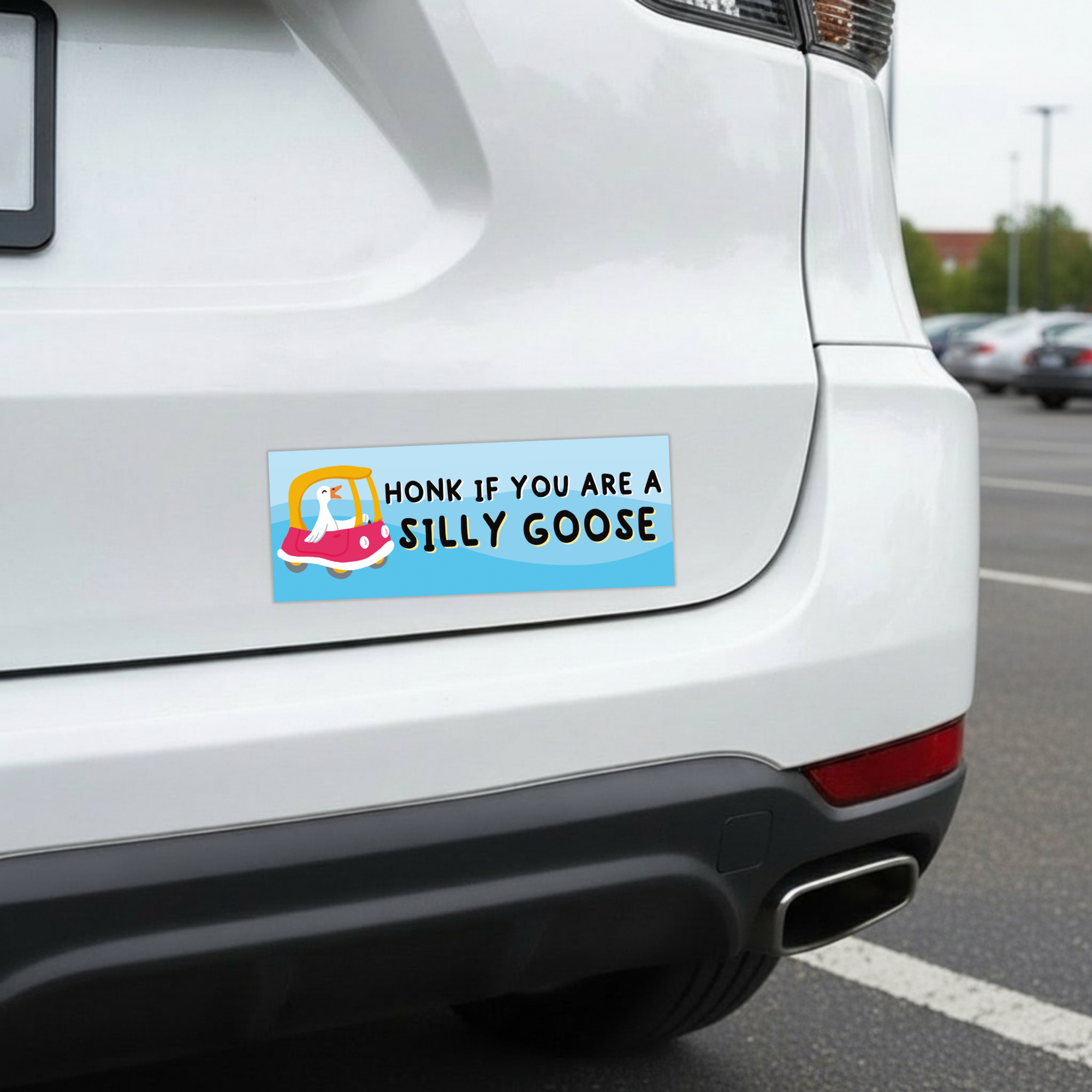 Sleazy Greetings funny bumper magnet displayed on the back of a white car featuring the phrase ‘Honk If You Are A Silly Goose’ in playful black lettering on a pastel blue background with a cute cartoon goose driving a pink toy-style car. Humorous novelty car magnet with whimsical goose humor and colorful illustrated design shown in real-life automotive use.