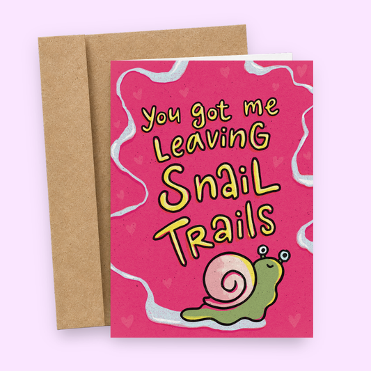 Sleazy Greetings funny love card interior featuring a cute green snail with a pink shell, pink hearts, and a light blue wavy border, with blank space for a handwritten message.