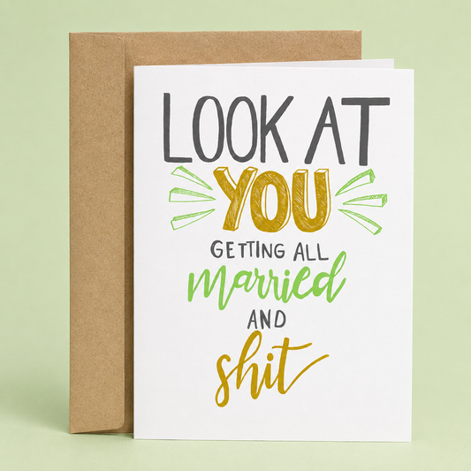 Sleazy Greetings funny wedding card featuring playful hand-lettered typography on a clean white background. The card reads, “Look At You Getting All Married and Shit,” offering a sarcastic and lighthearted way to celebrate an engagement, wedding, or newlywed couple. Displayed with a kraft envelope, this humorous wedding congratulations card is perfect for friends, siblings, coworkers, brides, grooms, and couples with a sense of humor.