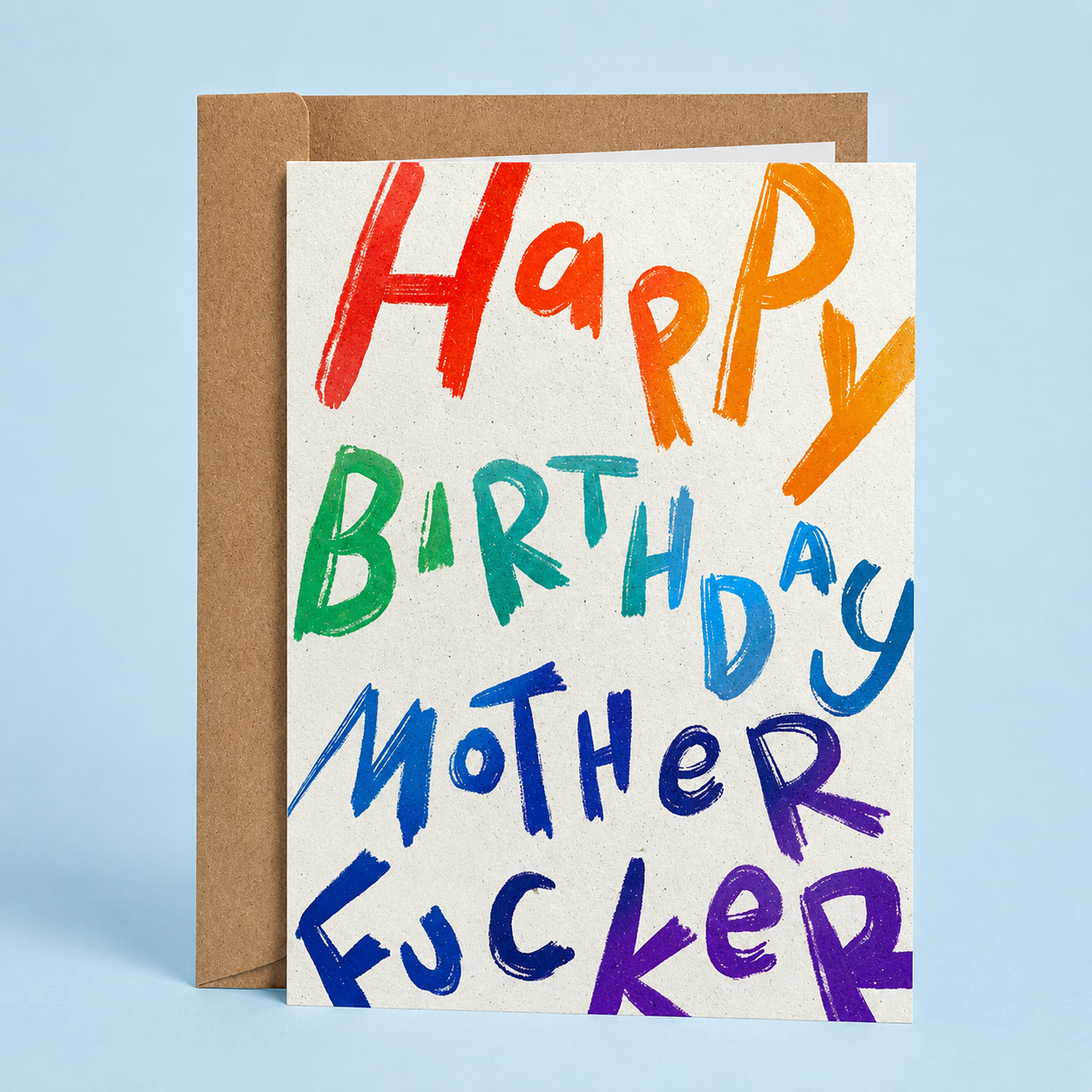 Sleazy Greetings funny adult birthday card featuring colorful childlike hand-drawn lettering on a textured white background that reads “Happy Birthday Mother Fucker,” paired with a kraft envelope.