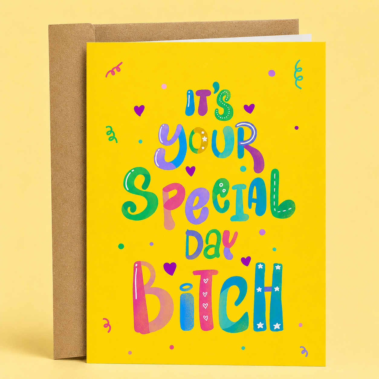 Sleazy Greetings funny birthday greeting card featuring colorful hand-lettered typography, hearts, and confetti on a bright yellow background with the cheerful message “It’s Your Special Day Bitch,” displayed with a kraft envelope for a humorous birthday card, gag gift, or fun birthday card for best friends, sisters, coworkers, and loved ones.