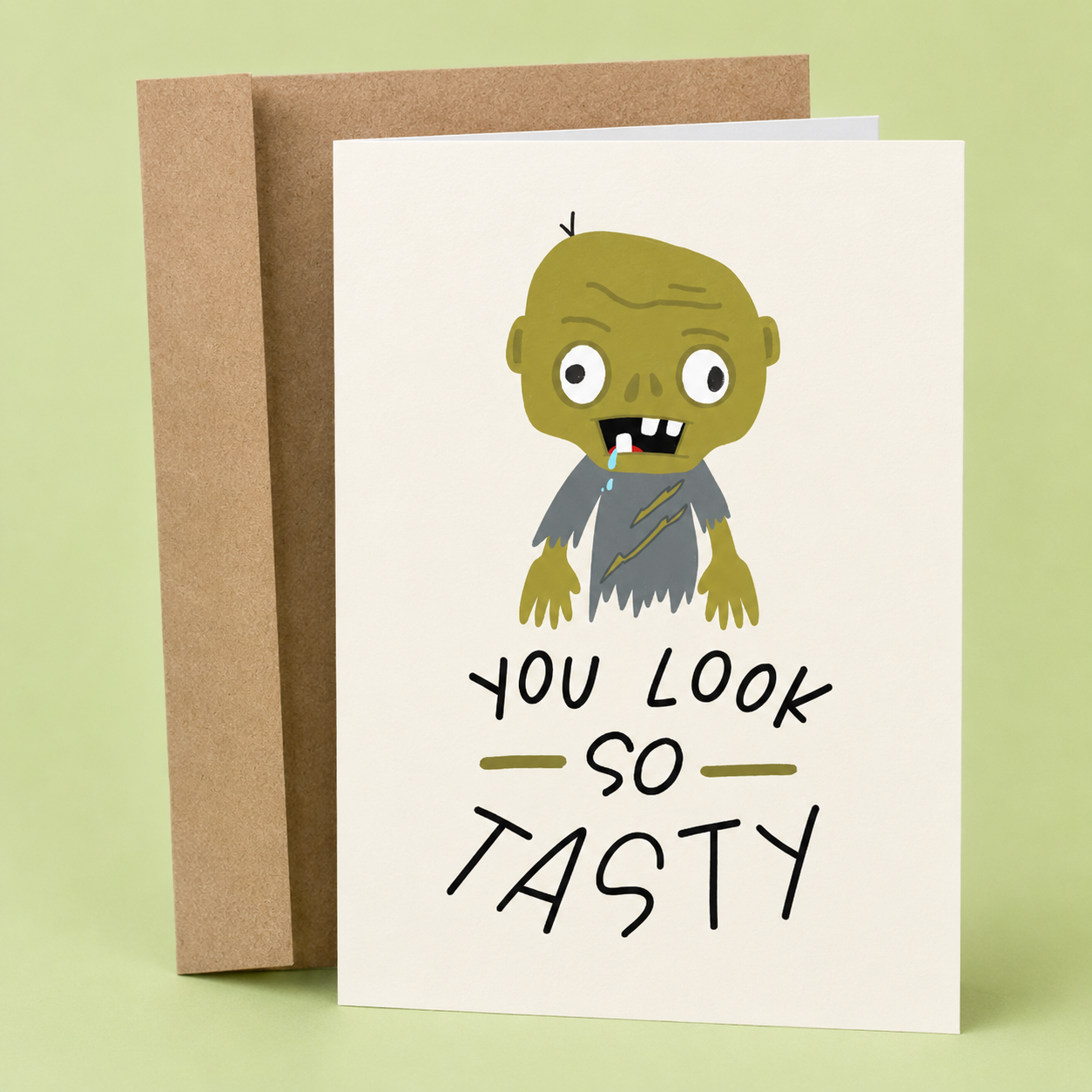 Sleazy Greetings funny birthday card featuring a goofy zombie illustration and the phrase “You Look So Tasty,” a humorous birthday card for horror fans, zombie lovers, friends, family, coworkers, husband, wife, boyfriend, or girlfriend with a spooky sense of humor.