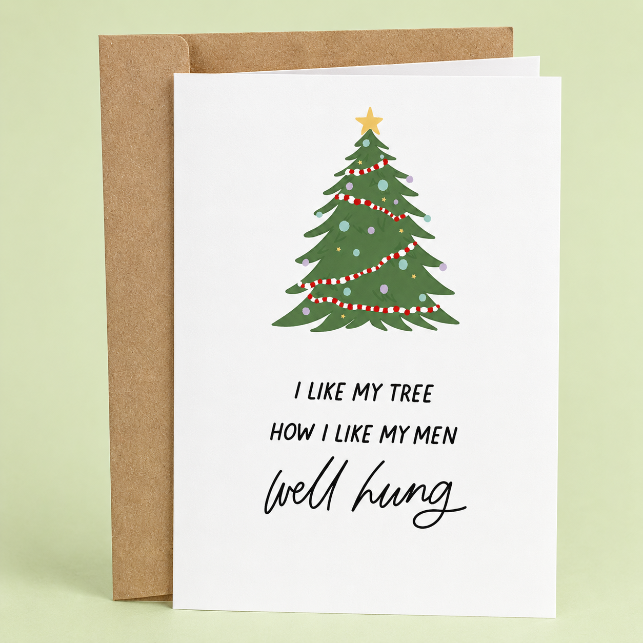 Sleazy Greetings funny adult Christmas greeting card featuring a decorated Christmas tree and the phrase “I Like My Tree How I Like My Men, Well Hung,” a humorous naughty holiday card for boyfriend, girlfriend, husband, wife, partner, Christmas parties, gift exchanges, or anyone who enjoys cheeky Christmas humor and festive innuendos.