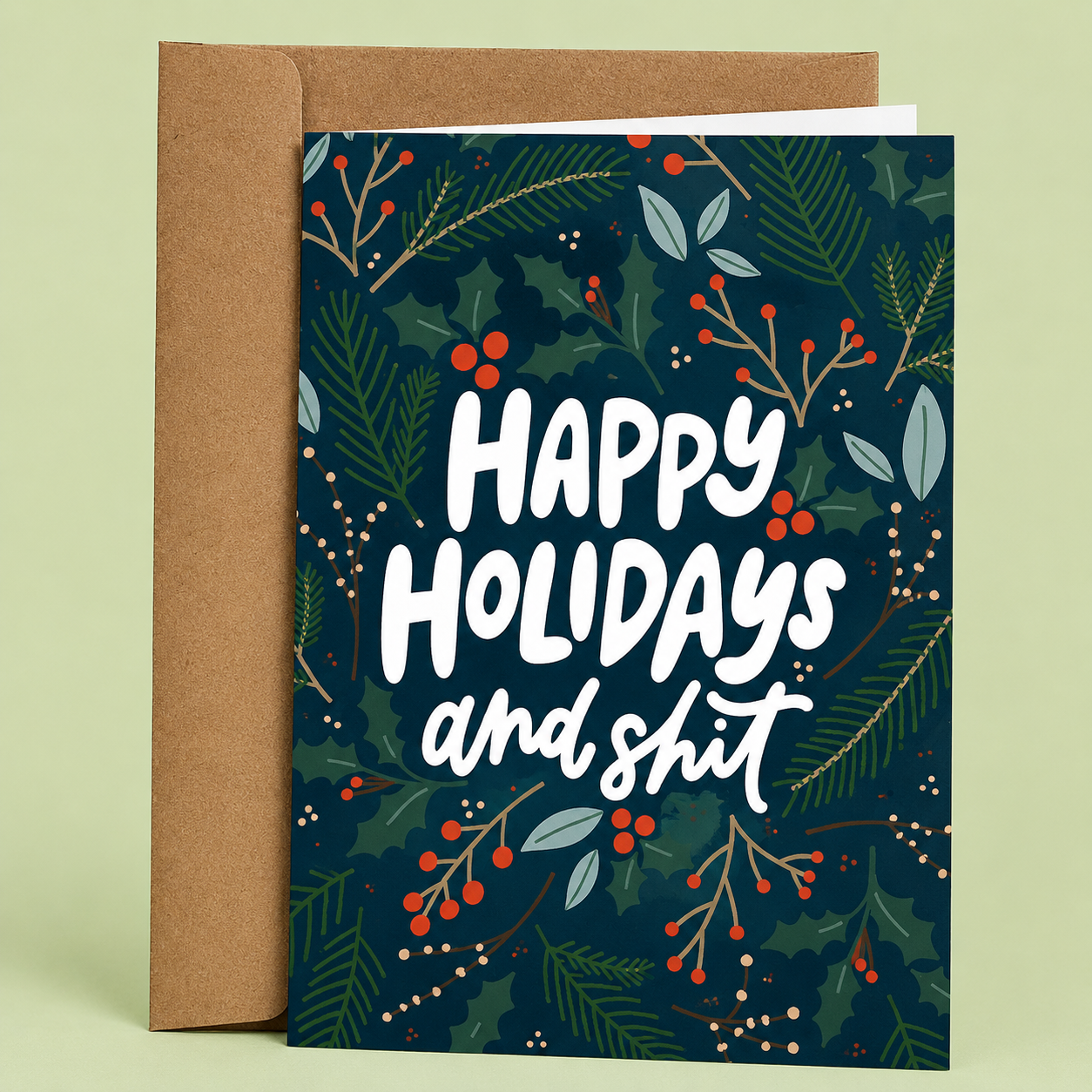 Sleazy Greetings funny Christmas greeting card featuring the phrase “Happy Holidays and Shit” with festive holly, pine branches, and winter greenery, a humorous holiday card for friends, family, coworkers, or Christmas gift giving.