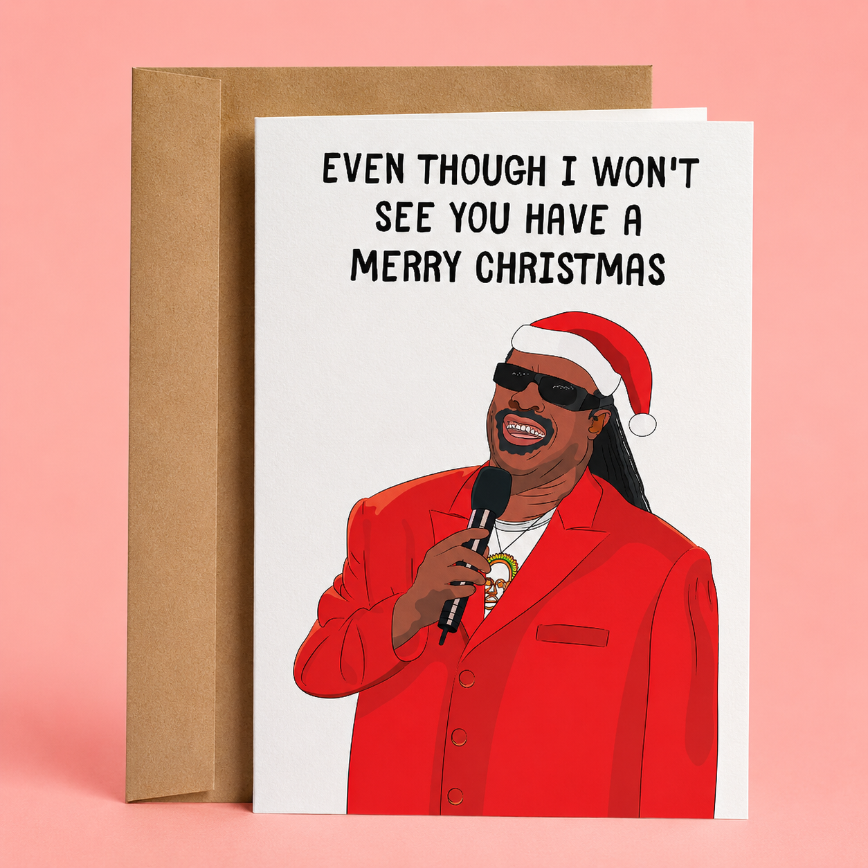Sleazy Greetings funny Christmas greeting card featuring a holiday illustration inspired by Stevie Wonder in a Santa hat and the phrase “Even Though I Won’t See You Have a Merry Christmas,” a humorous Christmas card for friends, family, coworkers, and holiday gift giving.