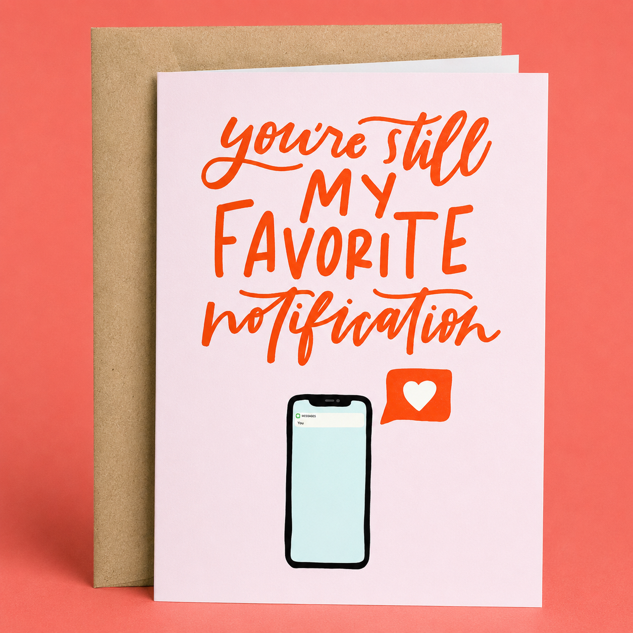 Sleazy Greetings romantic love greeting card featuring a smartphone with a heart notification icon and the affectionate message “You’re Still My Favorite Notification” on a soft pink background, displayed with a kraft envelope for an anniversary, Valentine’s Day, wedding, boyfriend, girlfriend, husband, or wife card.