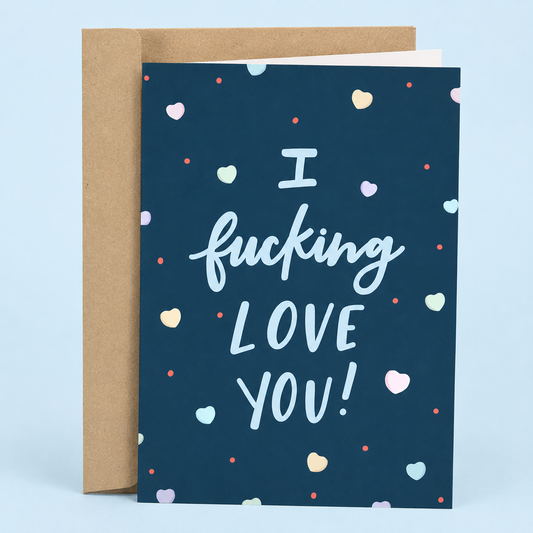 Sleazy Greetings funny love greeting card featuring pastel hearts scattered across a navy blue background with the bold romantic message “I Fucking Love You!”, displayed with a kraft envelope for an anniversary, Valentine’s Day, wedding, or everyday love card.