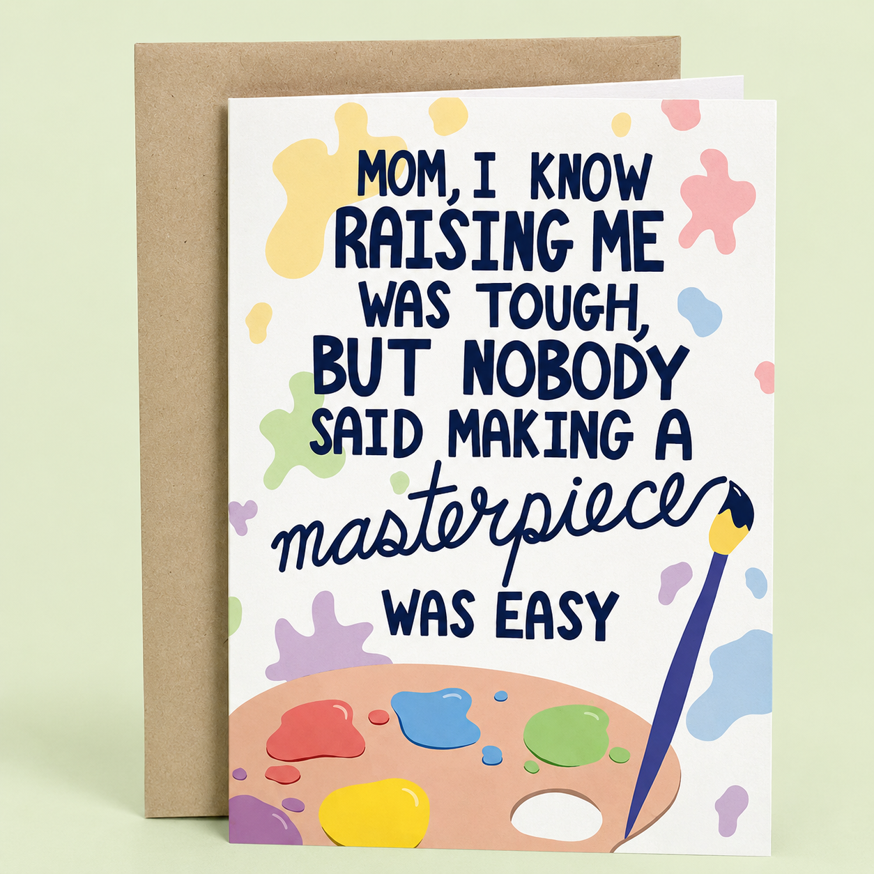 Sleazy Greetings funny Mother’s Day greeting card featuring a paint palette, paintbrush, and colorful paint splatters with the humorous message “Mom, I Know Raising Me Was Tough, But Nobody Said Making a Masterpiece Was Easy,” displayed with a kraft envelope for a funny and appreciative Mother’s Day gift.