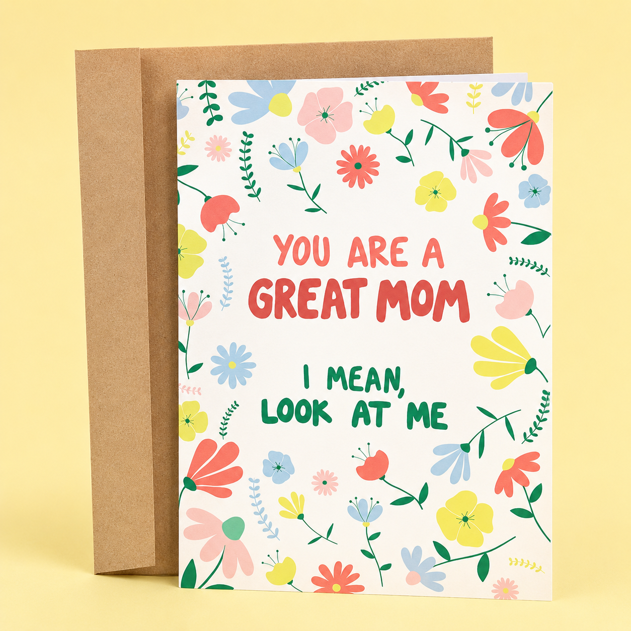 Sleazy Greetings funny Mother’s Day greeting card featuring colorful floral illustrations with the humorous message “You Are a Great Mom, I Mean, Look at Me” on a white background, displayed with a kraft envelope for a funny and appreciative Mother’s Day gift.