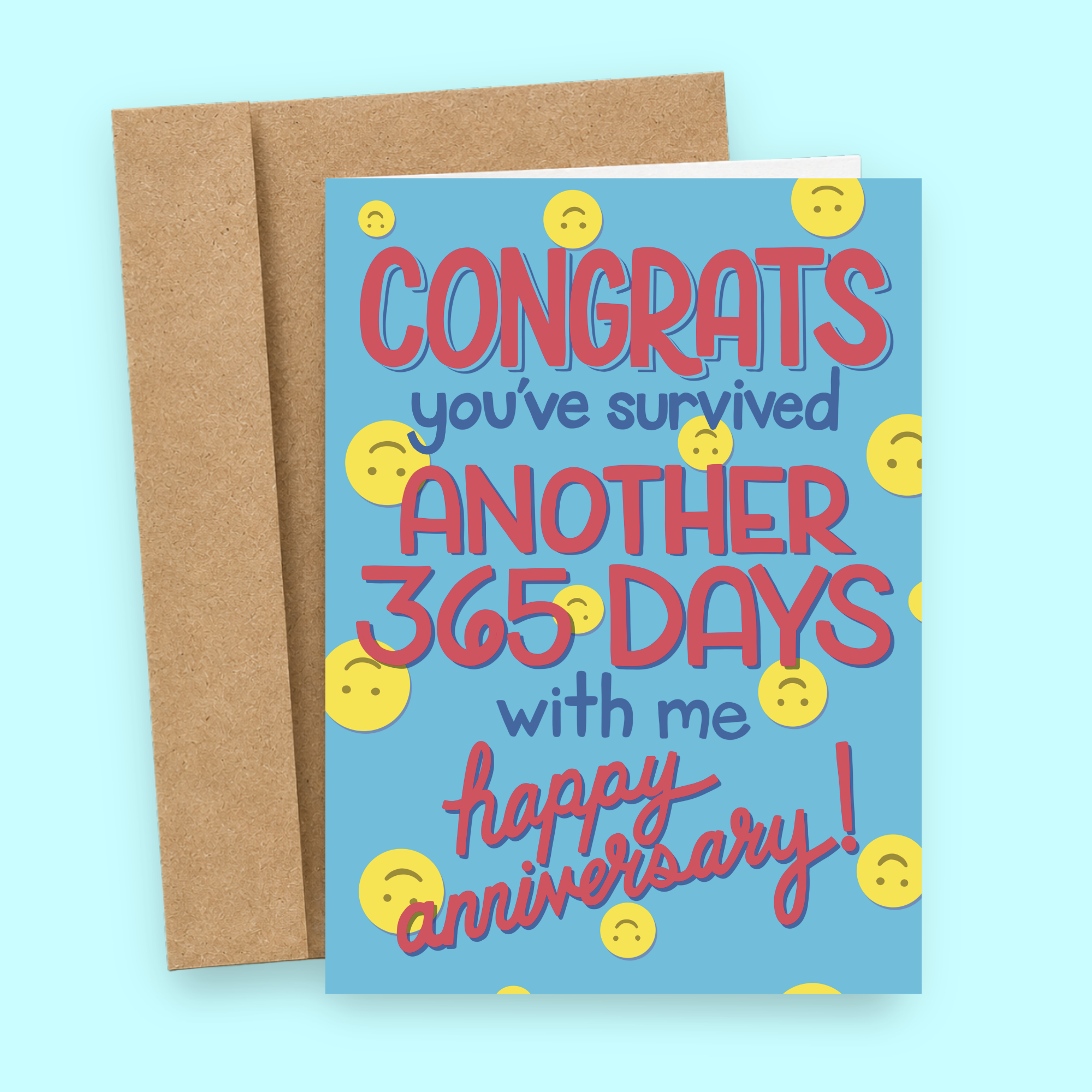 Sleazy Greetings funny anniversary card featuring yellow emoji faces on a bright blue background with bold pink lettering that reads, “Congrats You’ve Survived Another 365 Days With Me. Happy Anniversary!” Displayed with a kraft envelope.