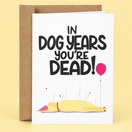 Sleazy Greetings funny dog birthday card featuring a sleeping dog wearing a party hat with a balloon nearby on a white background, with the darkly humorous message “In Dog Years You’re Dead!” paired with a kraft envelope.