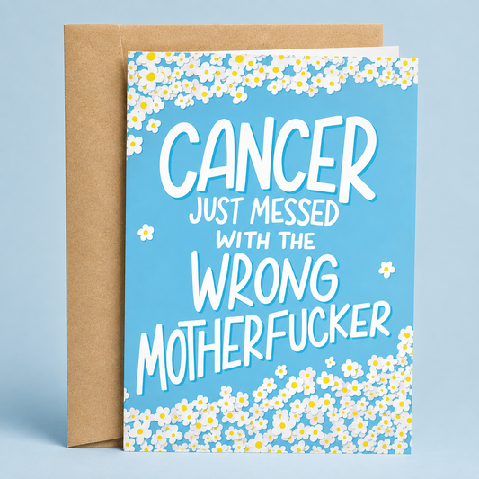 Sleazy Greetings funny cancer support card featuring a blue background framed with white daisies, with the bold empowering message “Cancer Just Messed With the Wrong Motherfucker,” paired with a kraft envelope.