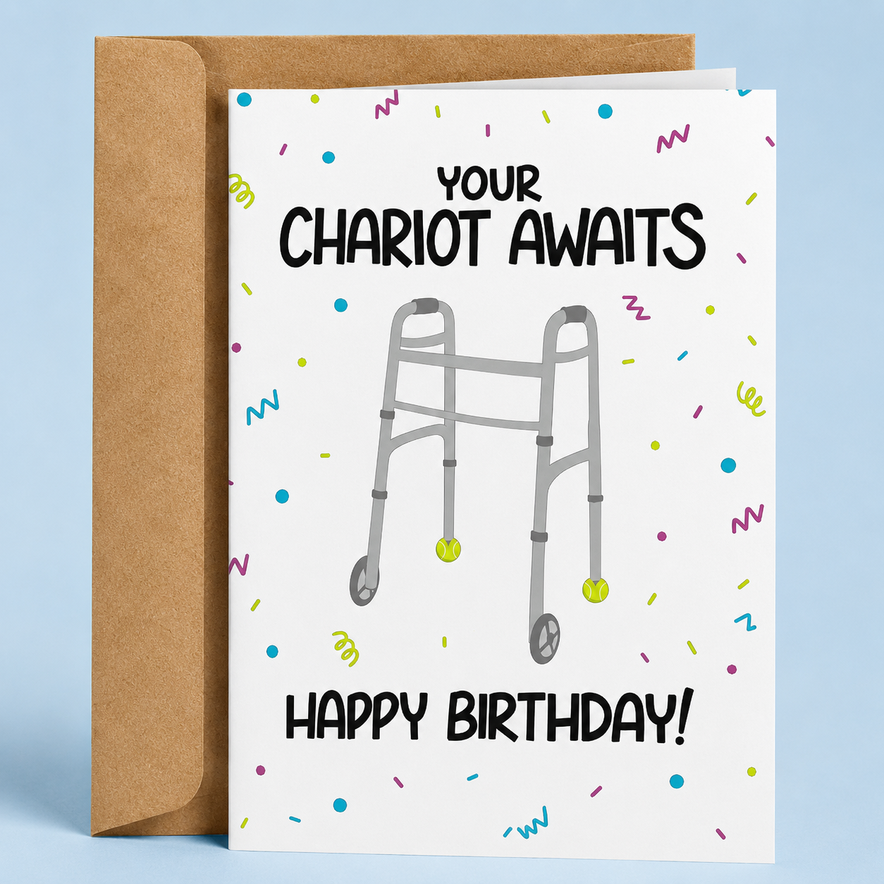 Sleazy Greetings funny birthday card featuring a walker decorated with tennis balls on the front legs surrounded by colorful confetti, with the age-related joke “Your Chariot Awaits. Happy Birthday!” paired with a kraft envelope.