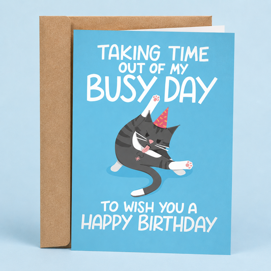 Sleazy Greetings funny birthday card featuring a mischievous gray tabby cat wearing a party hat and licking itself on a blue background, with the sarcastic message “Taking Time Out of My Busy Day To Wish You a Happy Birthday,” paired with a kraft envelope.