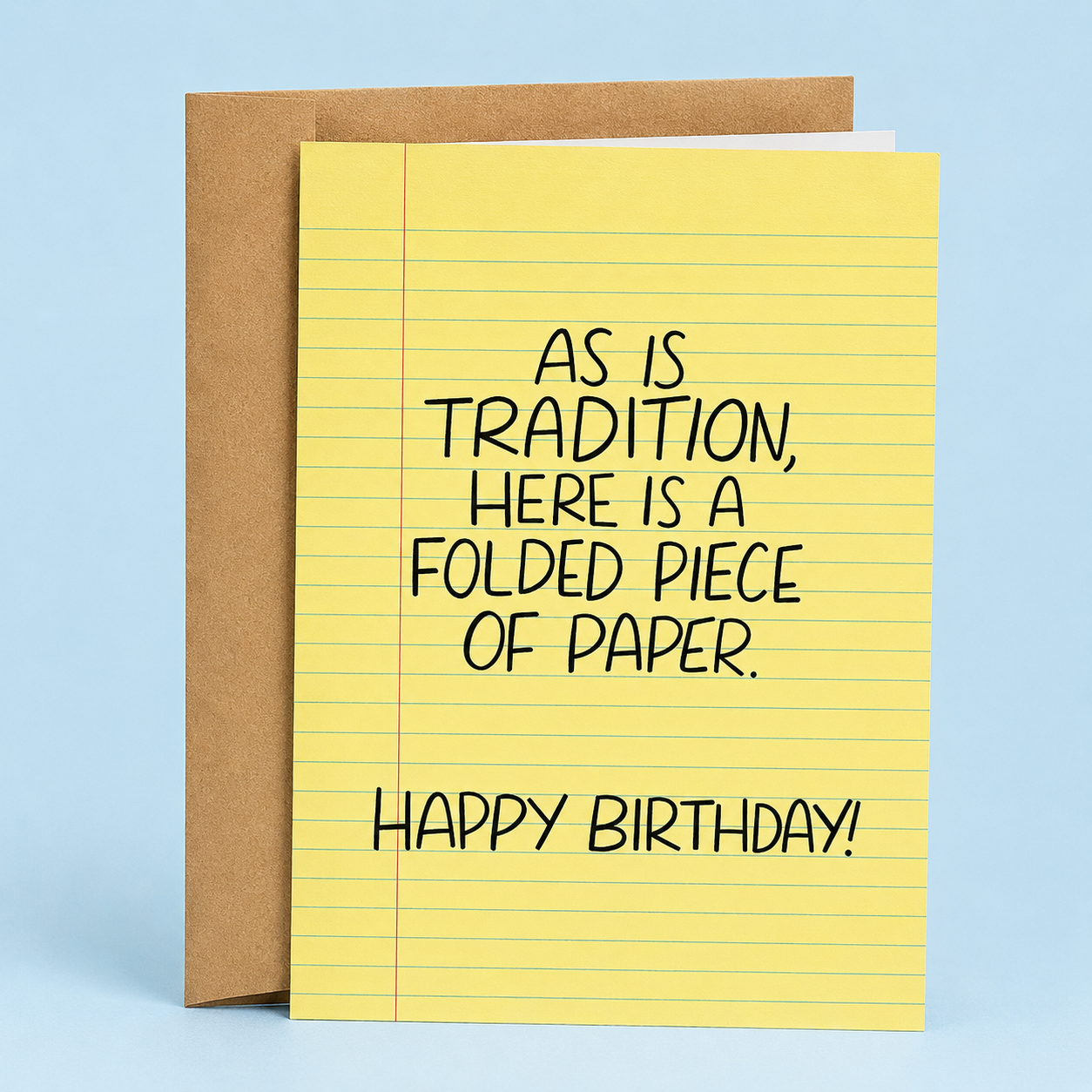 Sleazy Greetings funny birthday card designed like a yellow legal notepad page with the sarcastic message “As Is Tradition, Here Is a Folded Piece of Paper. Happy Birthday!” paired with a kraft envelope.