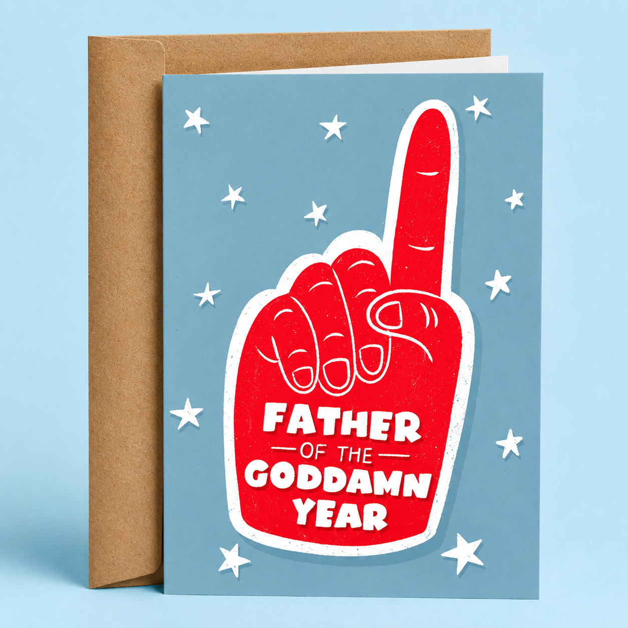 Sleazy Greetings funny Father’s Day card featuring a red foam finger on a blue background with stars and the message “Father Of The Goddamn Year,” paired with a kraft envelope.