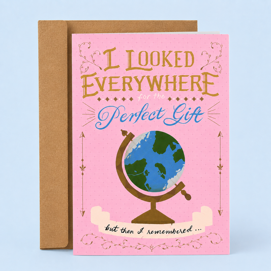 Sleazy Greetings funny love and anniversary card featuring a globe on a pink vintage-inspired background with the message “I Looked Everywhere for the Perfect Gift” and decorative flourishes, paired with a kraft envelope.