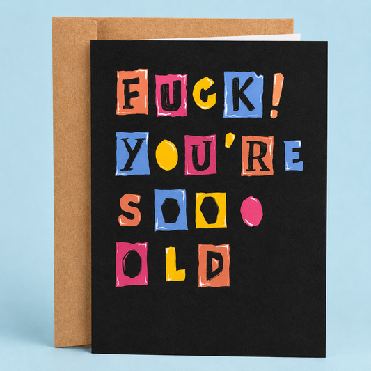 Sleazy Greetings funny birthday card featuring colorful ransom-note style lettering on a black background with the message “Fuck! You’re Soo Old,” paired with a kraft envelope.