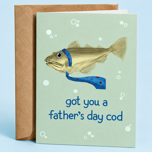 Sleazy Greetings funny Father’s Day greeting card featuring a fish wearing a blue necktie underwater with the pun “Got You A Father’s Day Cod” on a light green background, paired with a kraft envelope.