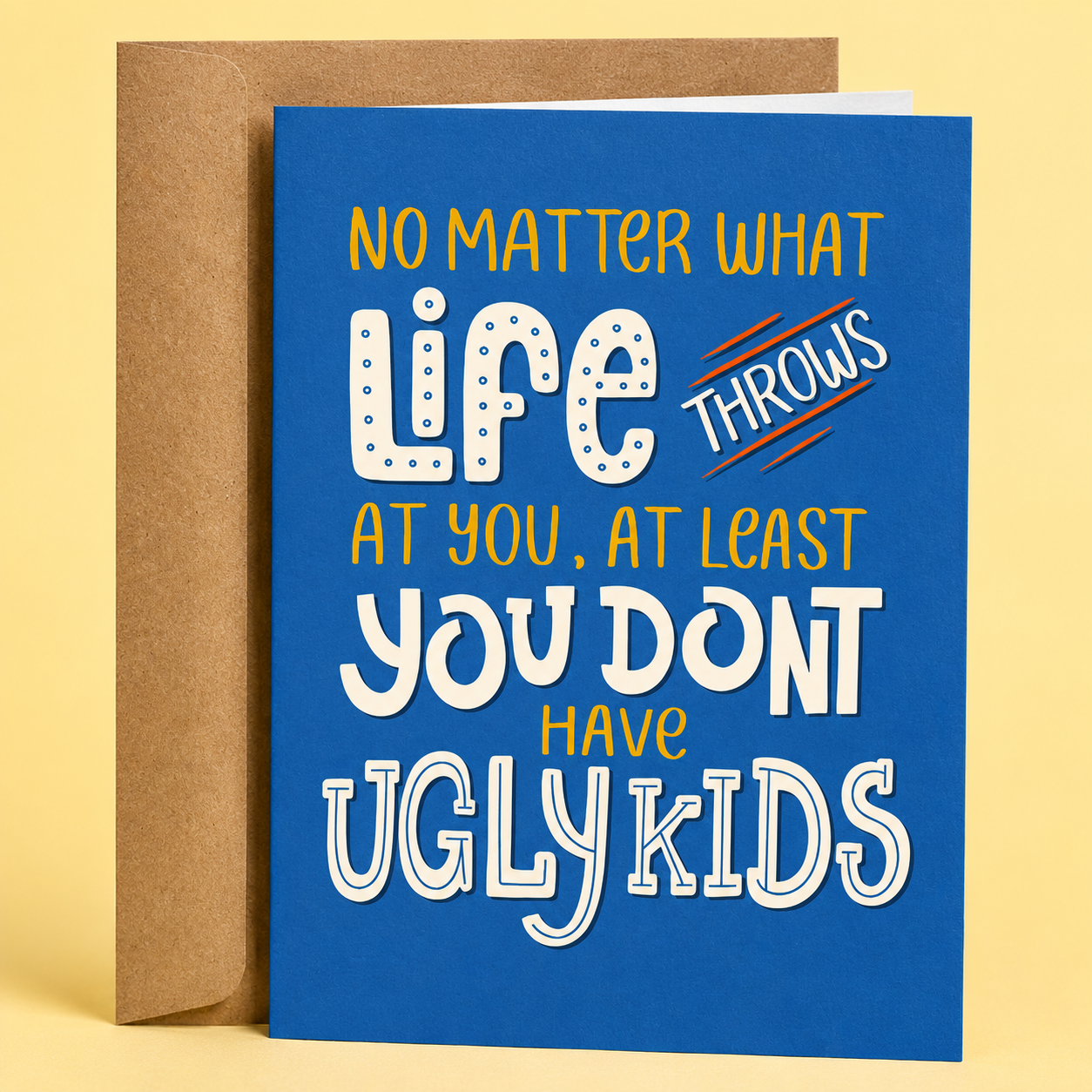 Sleazy Greetings funny parenting greeting card reading “No Matter What Life Throws At You, At Least You Don't Have Ugly Kids” on a blue background with playful typography and kraft envelope.