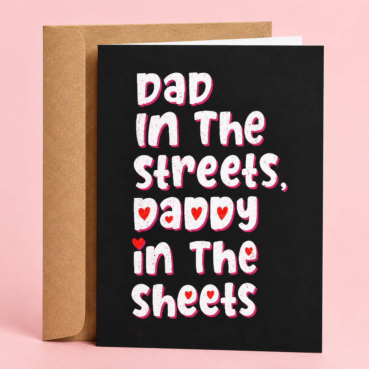 Sleazy Greetings funny Father’s Day greeting card featuring bold white and pink lettering on a black background that reads “Dad In The Streets, Daddy In The Sheets,” paired with a kraft envelope.