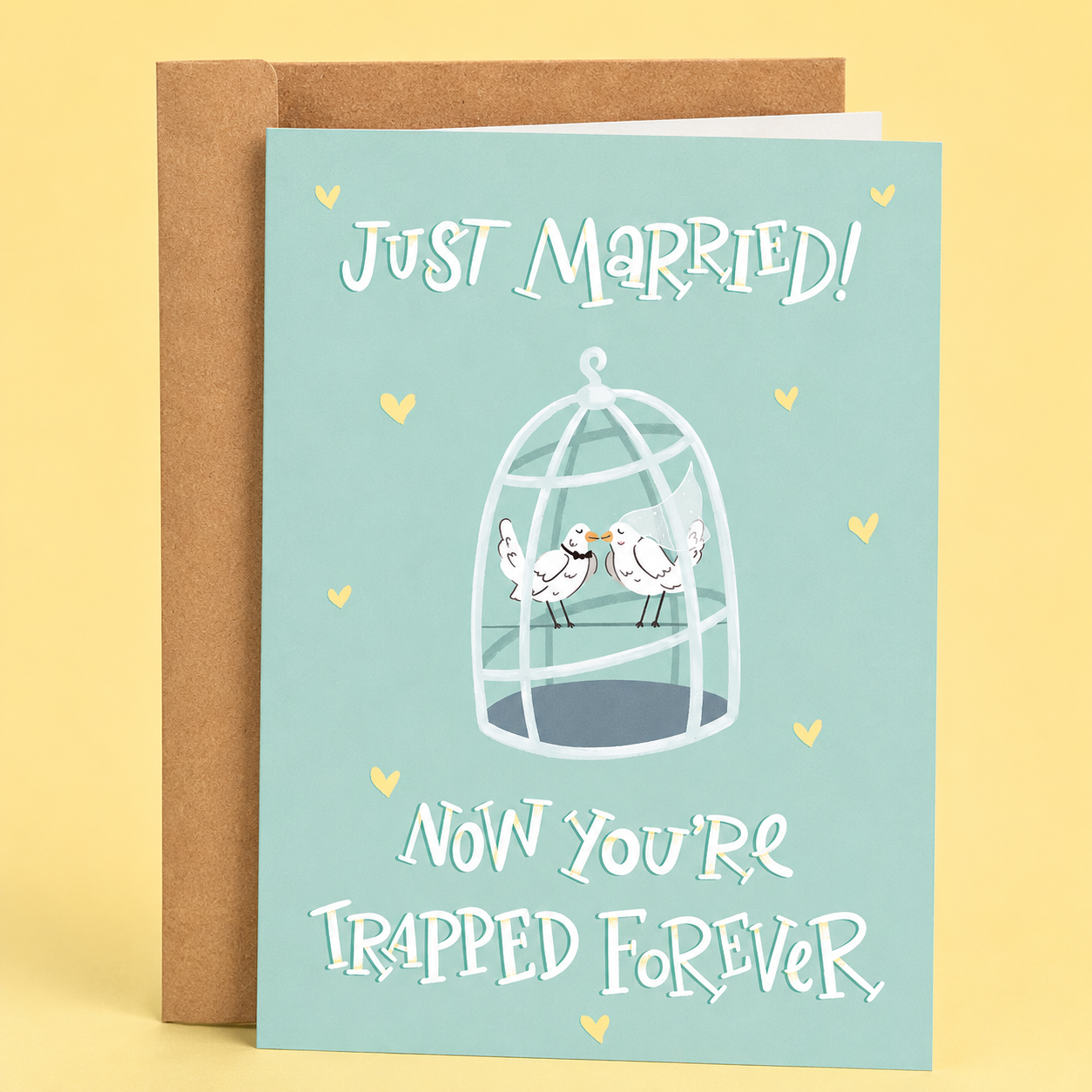 Sleazy Greetings funny wedding or anniversary card featuring “Just Married! Now You’re Trapped Forever” humor with cute birds in a cage illustration, sarcastic marriage comedy, and playful pastel relationship design on premium matte cardstock with kraft envelope.
