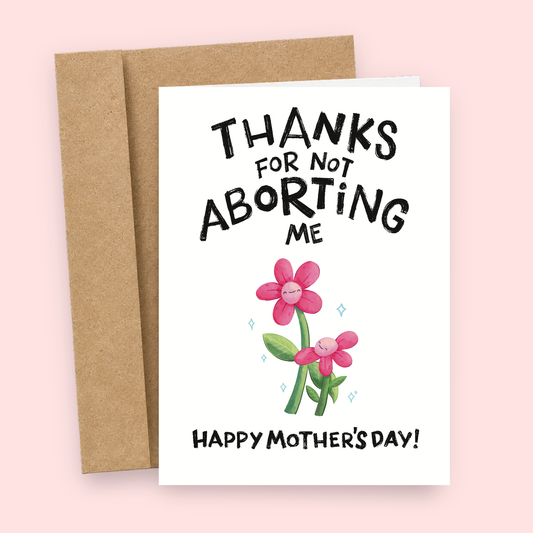 Sleazy Greetings funny Mother’s Day card featuring “Thanks For Not Aborting Me” dark humor with cute smiling flower illustrations, sarcastic appreciation joke, and bold hand-lettered typography on premium matte cardstock with kraft envelope.