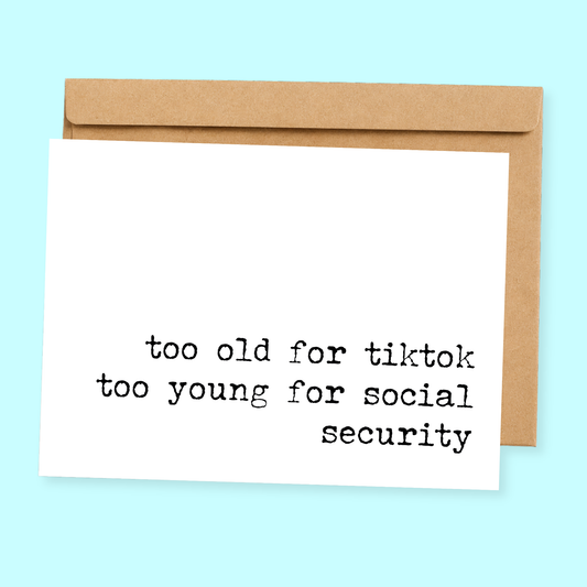 Sleazy Greetings funny birthday card featuring “Too old for TikTok, too young for social security” humor with minimalist typewriter-style typography design on premium matte cardstock with kraft envelope.