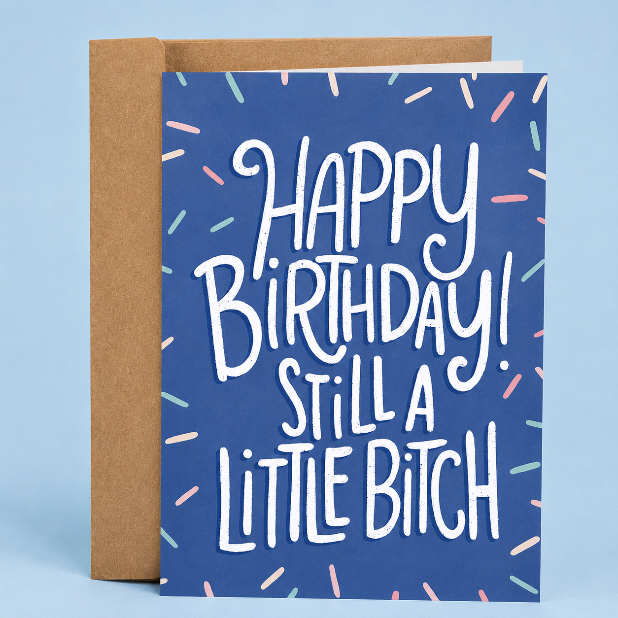 Sleazy Greetings funny birthday card featuring “Happy Birthday! Still A Little Bitch” humor with bold hand-lettered typography, colorful sprinkle confetti accents, and playful sarcastic design on premium matte cardstock with kraft envelope.