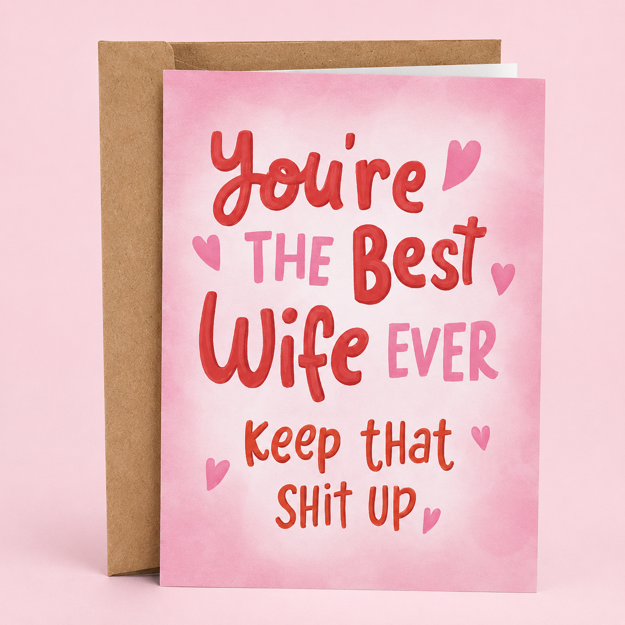 Sleazy Greetings funny wife appreciation card featuring “You’re The Best Wife Ever, Keep That Shit Up” humor with pink hand-lettered typography and heart accents on premium matte cardstock with kraft envelope.