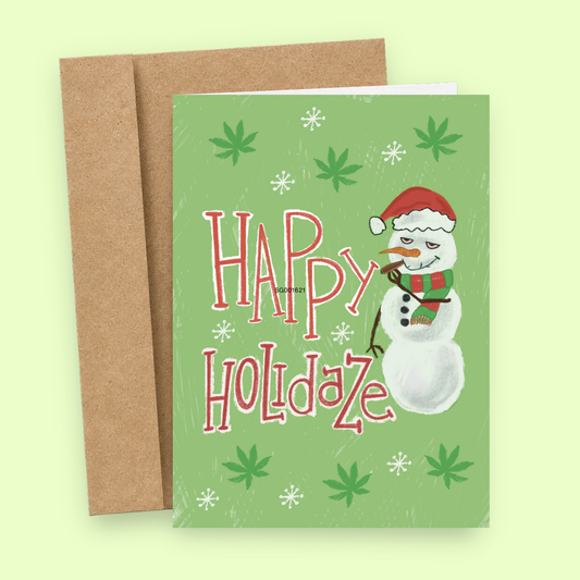 Sleazy Greetings funny Christmas card featuring “Hapy Holidaze” marijuana humor with stoned snowman, Santa hat, and cannabis leaf illustration on premium matte cardstock with kraft envelope.