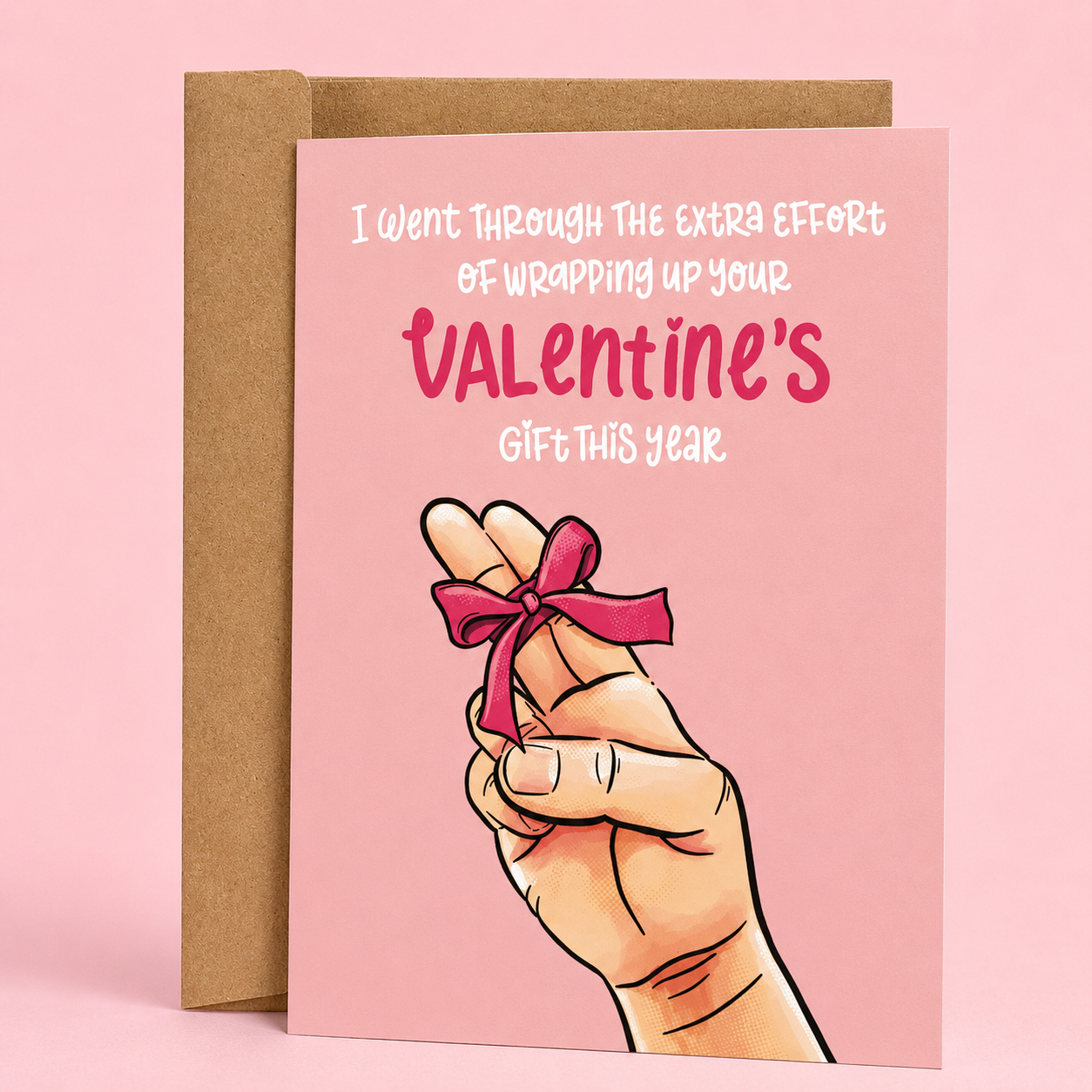 Sleazy Greetings funny Valentine’s Day card featuring “I went through the extra effort of wrapping up your Valentine’s gift this year” humor with illustrated hand and bow design on premium matte cardstock with kraft envelope.
